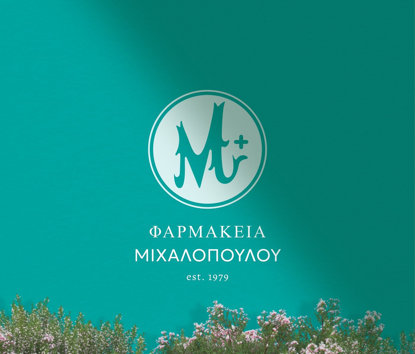 Michalopoulou Pharmacy — 45 years of care, rewritten in one monogram.